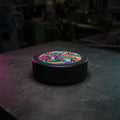 Hockey puck with a full color printed top face